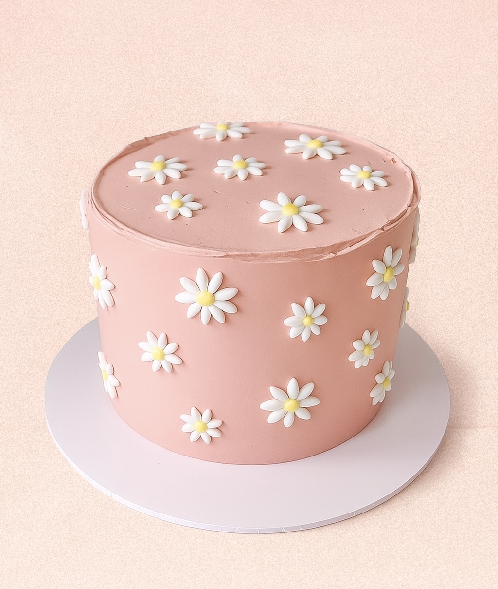 Tarta rosa con margaritas
